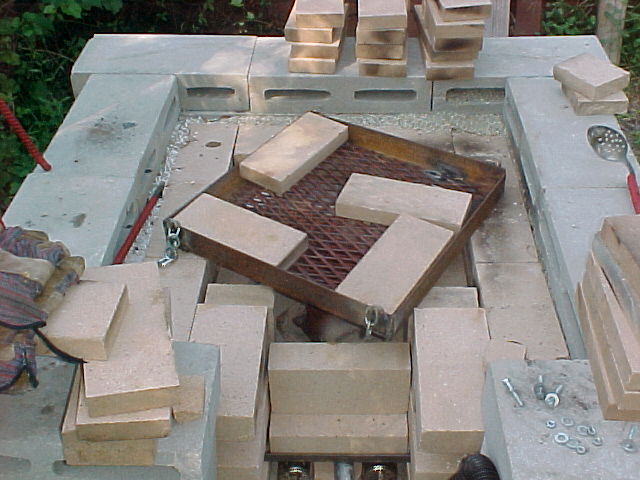 angle iron frame with test firebricks in place on top of furnace